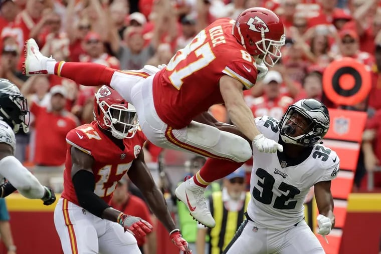 Kansas City Chiefs tight end Travis Kelce (87) leaps over Philadelphia Eagles cornerback Rasul Douglas (32) for a touchdown during the second half of an NFL football game in Kansas City, Mo., Sunday, Sept. 17, 2017. (AP Photo/Charlie Riedel)