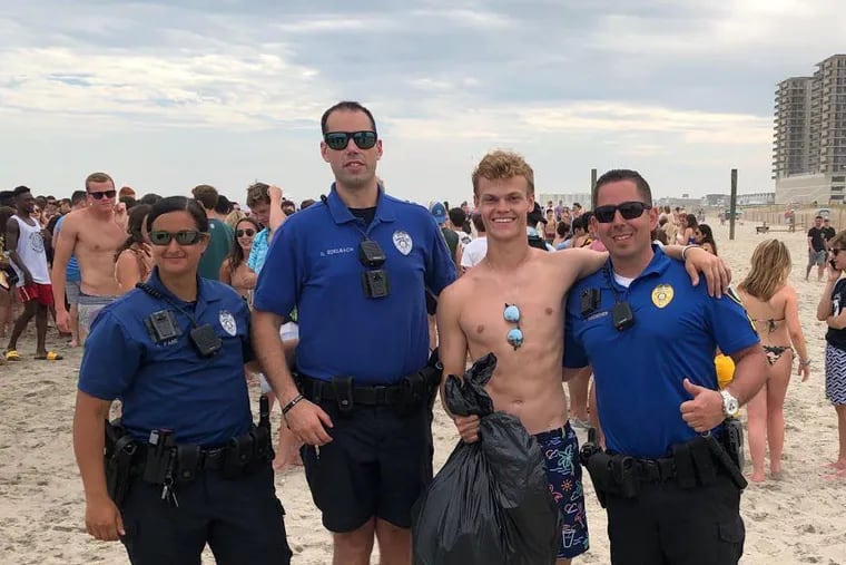 Margate police say the crowds of teens who congregate every year did not cause problems as they had in prior years. Police brought trash bags to the beach this year and asked the teens to help out. Reed Sullivan, above, collected 33 bags.
