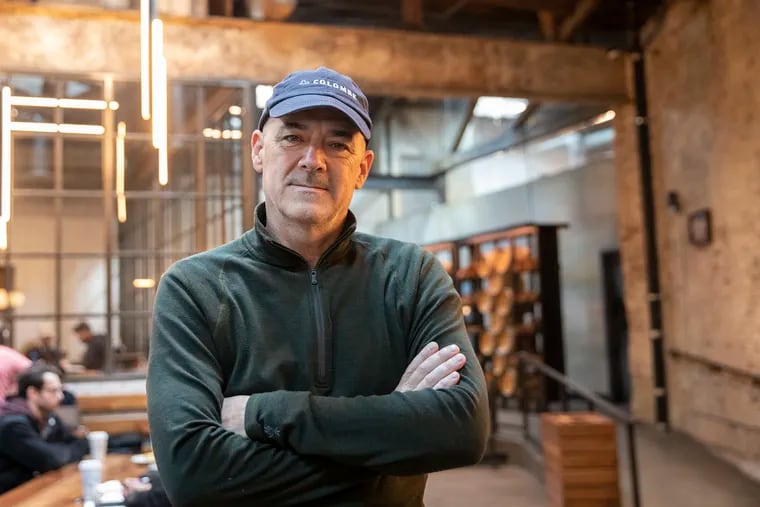 Todd Carmichael, owner of La Colombe coffee, at his company's flagship in Fishtown. He advocated for paying workers $15 an hour but does not pay his workers that wage.