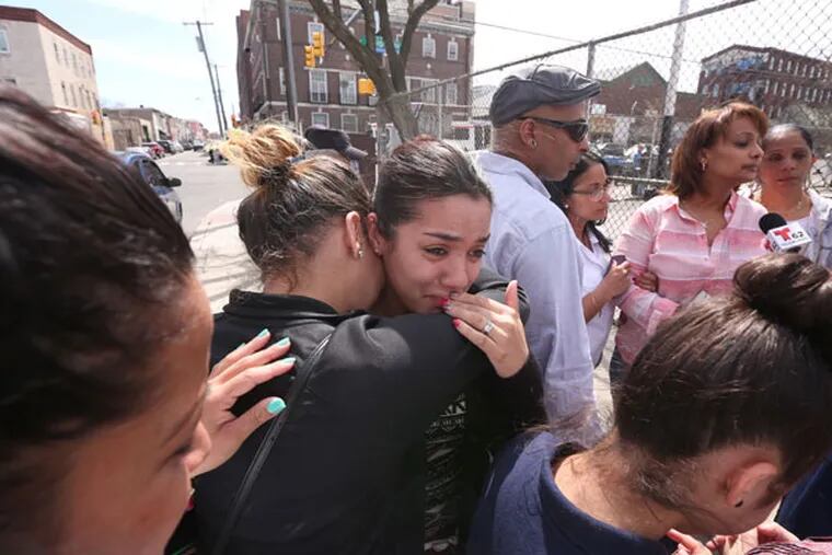 Alexis Aponte, cousin, is comforted Glorivee Diaz.The family of 2-year-old hit-and run victim who died overnight from injuries sustained Monday after being hit by a car call a press conference to demand justice and to complain about the dangereous intersection where the child and his mother were hit, Thursday April 16, 2015. (David Swanson / Staff Photographer)