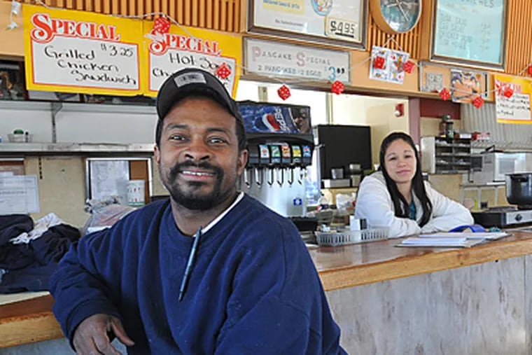 Peter Phang, inside his closed restaurant with girlfriend Alicia Rivera, had run Roney's since 2008. Its demise, due to the widening of Route 130 and work on nearby bridges, will allow Phang to devote himself to his bigger establishment, in Pennsauken. (Sharon Gekoski-Kimmel / Staff Photographer)