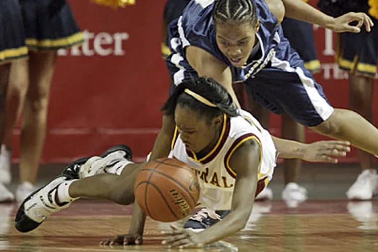Prep Charter's Courtney Edmonds, top, and Central High's Najah Jacobs, bottom, go after a loose ball during the 2009 Public League girls basketball championship. (Yong Kim / Staff Photographer)