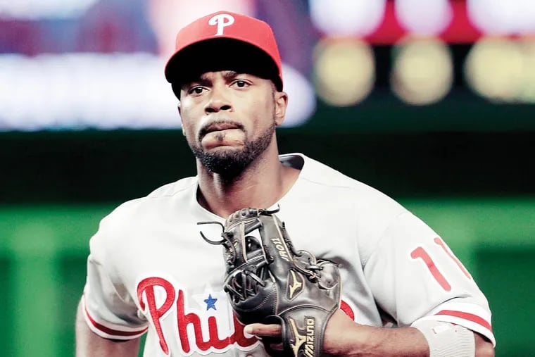 Philadelphia Phillies shortstop Jimmy Rollins (11) heads to the dugout during a baseball game against the Miami Marlins, Monday, Sept. 23, 2013, in Miami. (AP Photo/Alan Diaz)