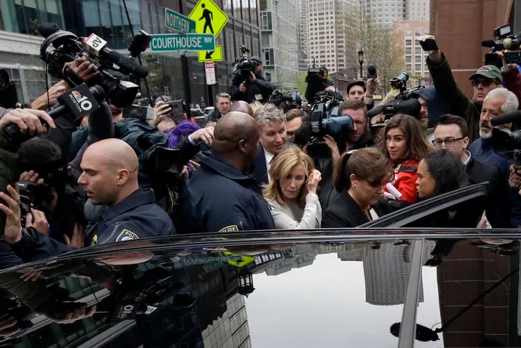 Felicity Huffman, center, gets into a vehicle followed by her brother Moore Huffman Jr., outside federal, Monday, May 13, 2019, in Boston, where she pleaded guilty to charges in a nationwide college admissions bribery scandal. Art imitates life, writes George Will, in a summer novel about the hyper-competitive world of elite college admissions.