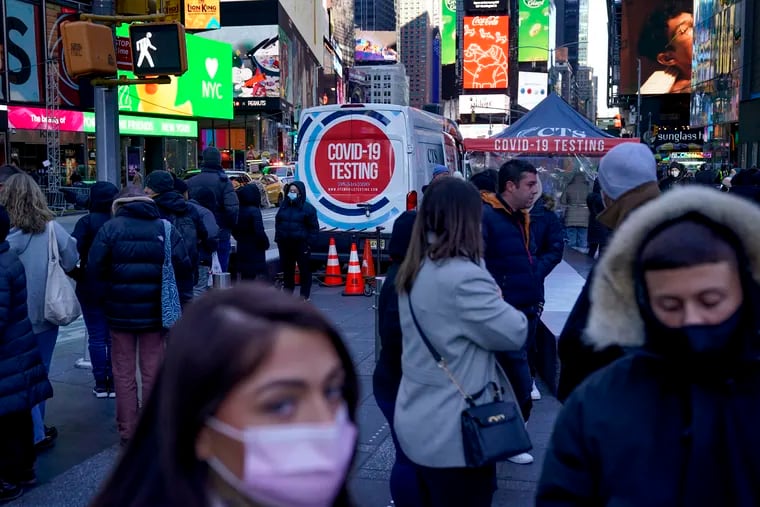 People wait in a long line to get tested for COVID-19 in Times Square, New York City on Dec. 20, 2021.