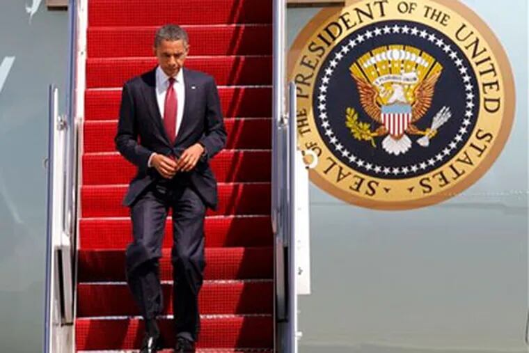 President Barack Obama exits Air Force One upon his return from Fort Stewart, Ga., Friday, April 27, 2012, at Andrews Air Force Base, Md. (AP Photo / Jacquelyn Martin)