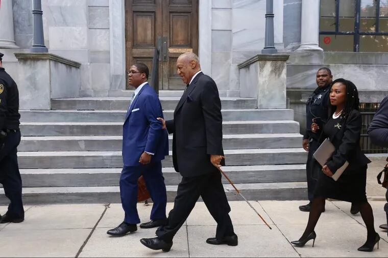 Bill Cosby exits the Montgomery County Courthouse on Tuesday, after a pretrial hearing in the sexual assault case in Norristown.