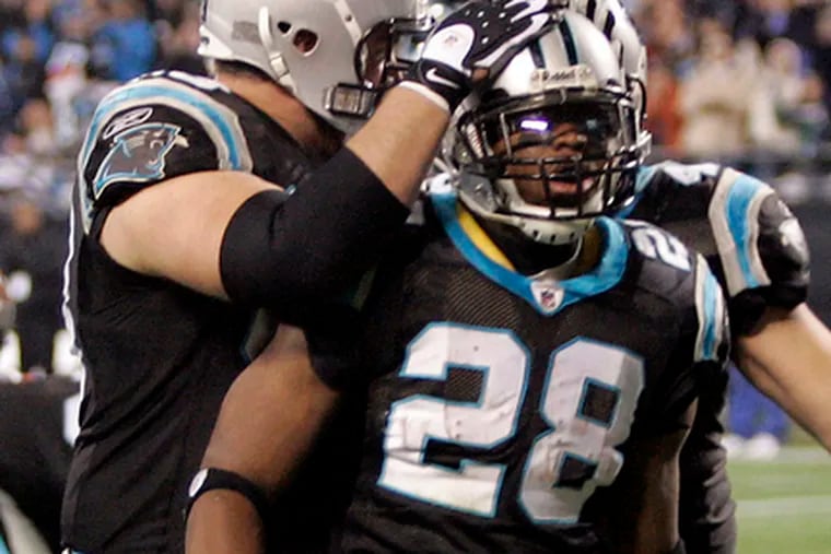 Panthers&#0039; Jonathan Stewart is congratulated after touchdown.