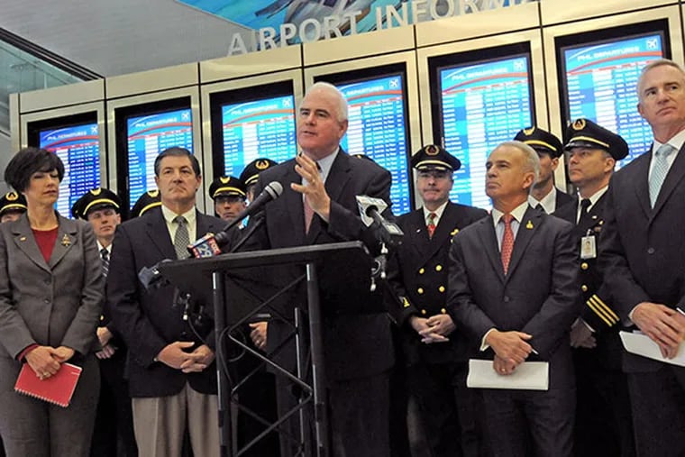 Airlines for America, U.S. Reps Patrick Meehan and others gather Dec. 18, 2013 at Philadelphia airport to support federal legislation that would prevent Abu Dhabi airport in the United Arab Emirates from getting a U.S. Customs pre clearance facility. ( APRIL SAUL  / Staff )