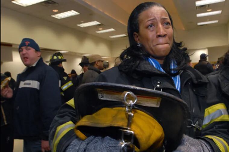 Renee Muhammad, one of Camden's four female firefighters, lost her job. So
did more than 100 workers, in addition to the 235 police and firefighters. (April Saul / Staff Photographer)