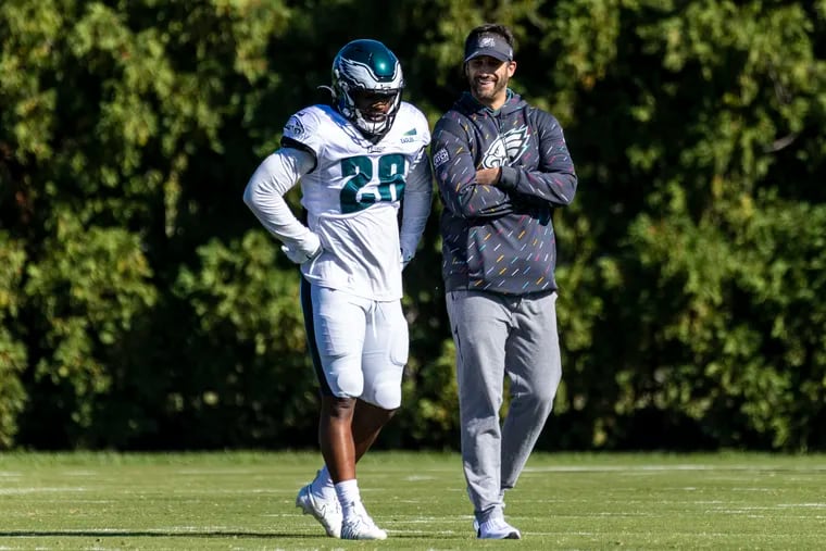 Philadelphia Eagles Head Coach Nick Sirianni talks with Eagles Running Back Miles Sanders (26), during practice on Wednesday at the NovaCare Complex on Oct. 20, 2021.