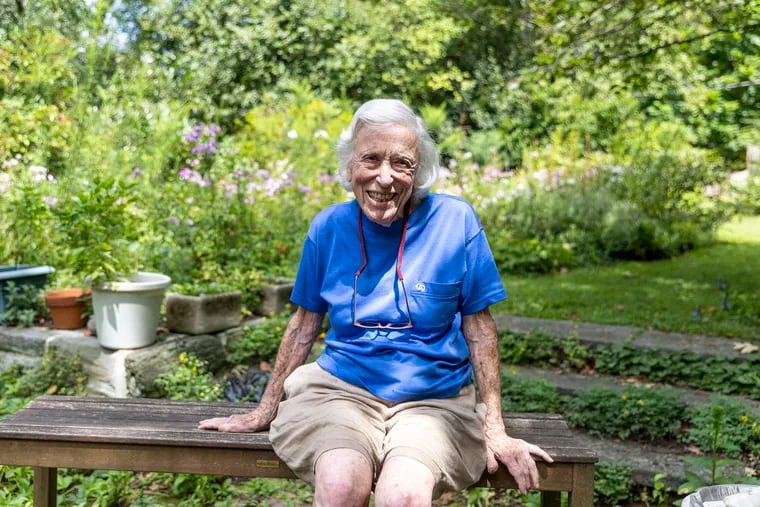 Hope Punnett, 96, poses for a portrait outside her West Mount Airy home. Punnett, a geneticist, is participating in a study on "superagers," people in good health over the age of 95.