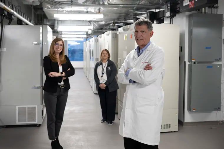 Penn Medicine BioBank co-directors Marylyn Ritchie, left, and Dan Rader are joined by technical director JoEllen Weaver, at rear. The BioBank's freezers contain blood and skin samples from tens of thousands of participating patients, leading to genetic discoveries on everything from heart disease to hearing loss.