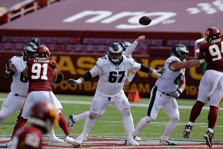 Nate Herbig (67) pass protects for Carson Wentz against Washington.