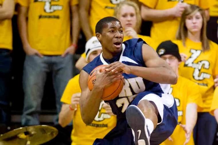 Oral Roberts' Kyron Stokes tries to call time in loss to Missouri.