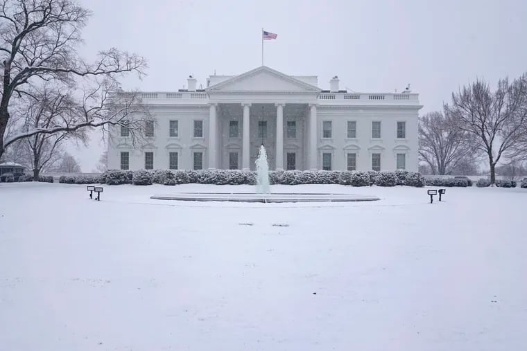 Snow falls on the North Lawn of the White House, Sunday, Jan. 31, 2021, in Washington.