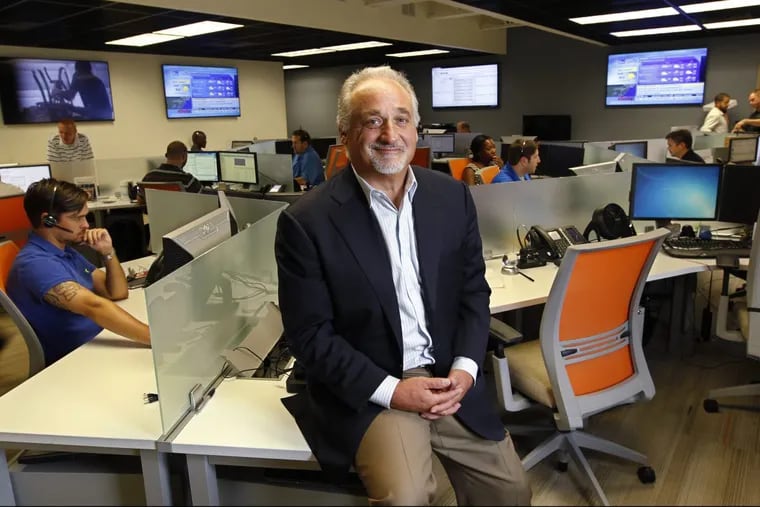 CEO, chairman and cofounder Tom Gravina, center, in Evolve IP's national operations center.
