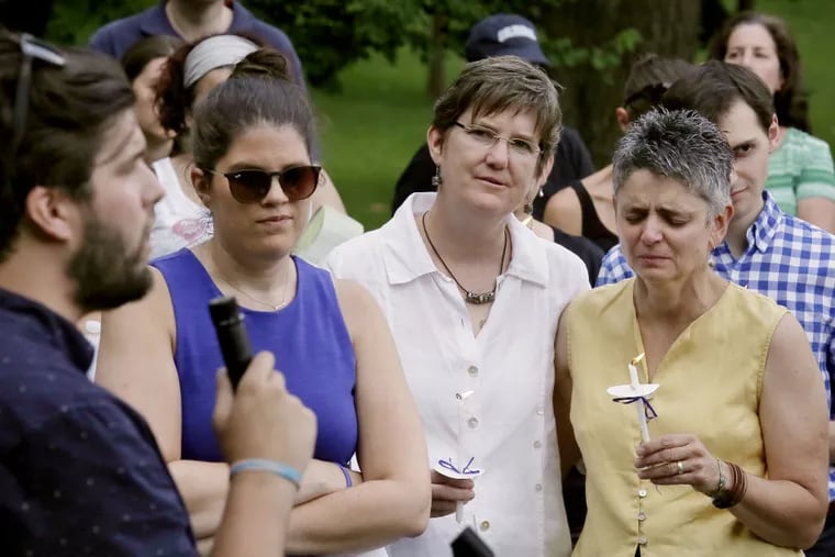 Margie Winters (second from right), who was fired as the director of religious studies at Waldron Mercy Academy after complaints about her same-sex marriage, at a vigil in her support in Merion on Sunday. (Elizabeth Robertson/Staff Photographer)