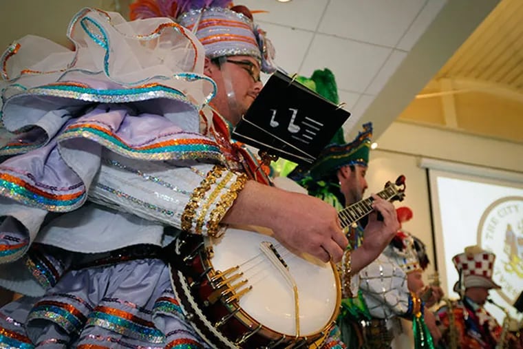 Kevin Sullivan from the Polish American String Band performs with other string bands  during a press conference at the Independence Visitors Center to announce plans for the 2014 Mummers Parade on Dec. 20, 2013. ( RON TARVER / Staff Photographer )