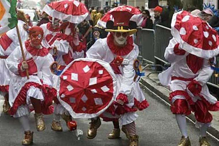 Zack Kreschollek (center) of South Philly struts with the Holy Rollers comics near the front of the 2008 parade. (ED HILLE / Staff Photographer)