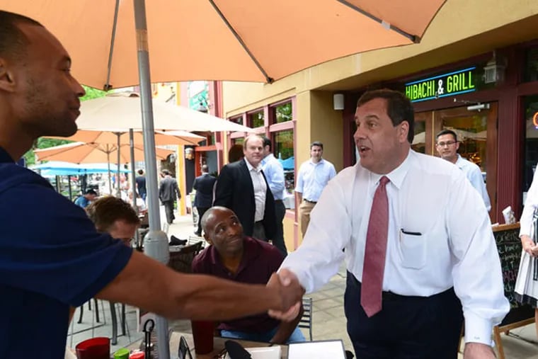 New Jersey Gov. Chris Christie shakes hands with people on the street
of Greenville, S.C., as he walks Main Street on Wednesday, June 3,
2015. (Photo by Heidi Heilbrunn/The Greenville News)