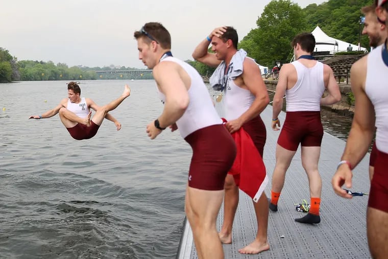Temple rowers jump into the Schuylkill after winning the varsity men's heavyweight eight final race at the Dad Vail Regatta Saturday, May 12, 2018.
