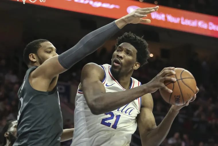 Joel Embiid (right) still doesn’t participate in every workout.