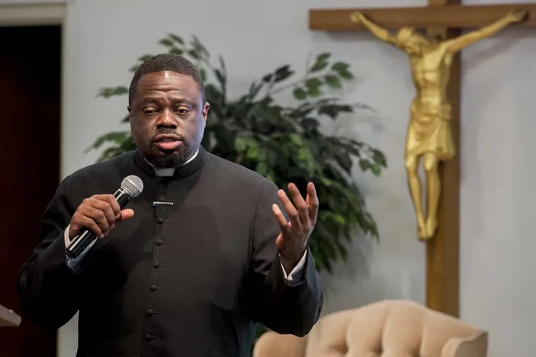 St. Charles Borromeo seminarian Jamey Moses, from Brooklyn, speaks to the audience about his calling to the priesthood during an event at the seminary designed to recruit African American Catholics into the priesthood.