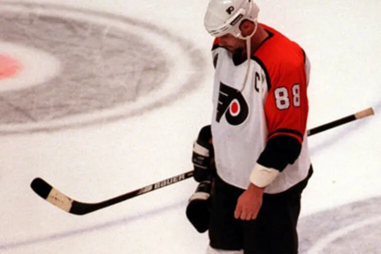 Eric Lindros dejectedly skates off the ice after losing to the Detroit Red Wings in the 1996 Stanley Cup Finals.  Now, former Flyer Bob Clarke thinks he belongs in the Hall of Fame. (File Photo)