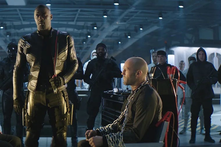 From left, Dwayne Johnson, Idris Elba and Jason Statham in "Hobbs & Shaw." (Universal Pictures/TNS)