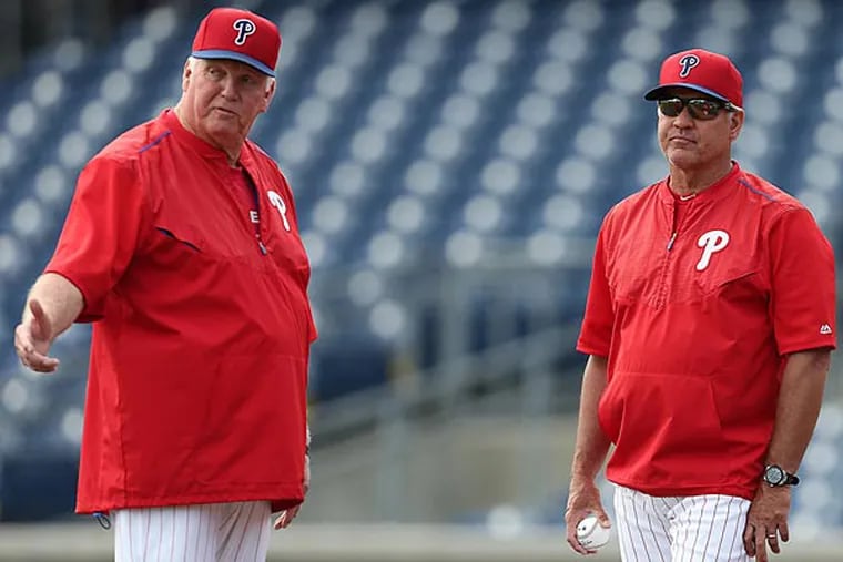 Charlie Manuel and Ryne Sandberg, talk before the Phillies play the Boston Red Sox. (David Maialetti/Staff Photographer)