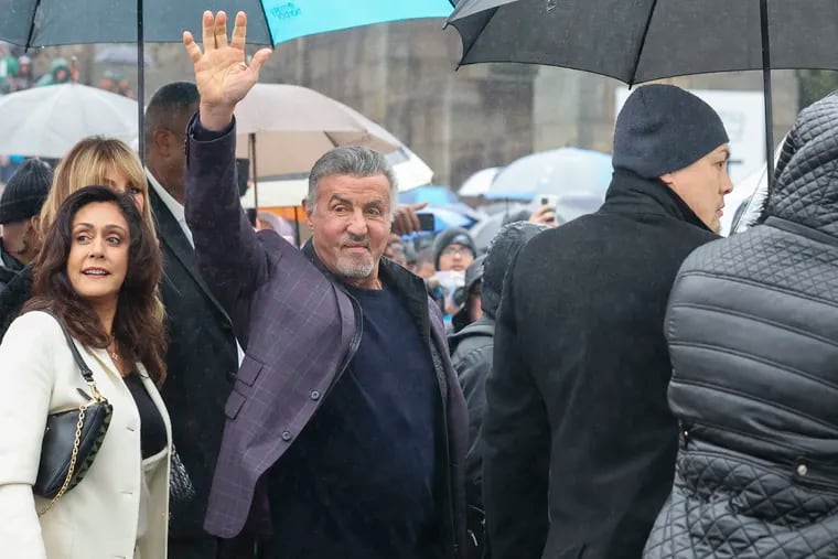 Sylvester Stallone waves to fans at the Philadelphia Museum of Art steps  on Dec. 3, which the City of Philadelphia has declared as Rocky Day.