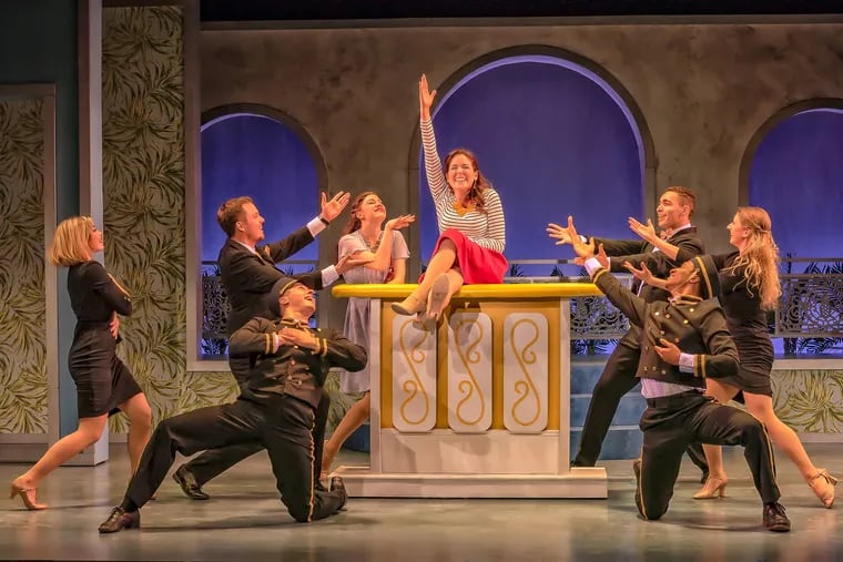 Bailey Seeker (center) and ensemble in "Dirty Rotten Scoundrels," through April 21 at the Resident Theatre Company in West Chester.