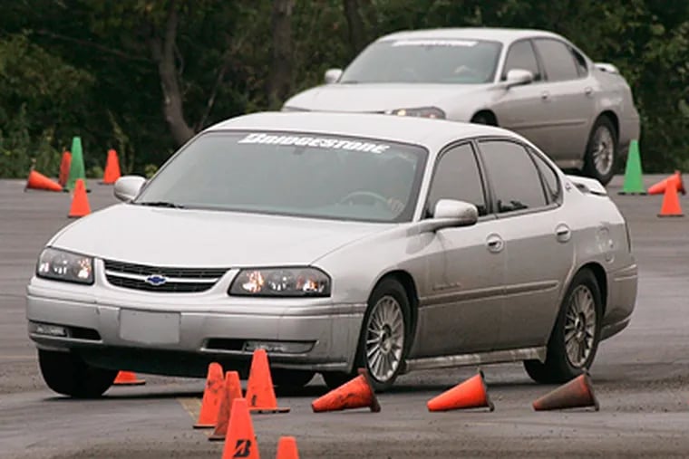 In the Driver's Edge program, teens learn how to react behind the wheel in real emergency situations as instructors simulate rapid lane changes, emergency braking and spin-outs. (AP Photo/Brian Kersey)