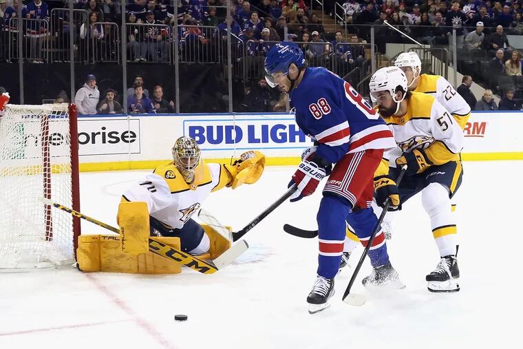 NEW YORK, NEW YORK - MARCH 19: Patrick Kane #88 of the New York Rangers moves in on Juuse Saros #74 of the Nashville Predators at Madison Square Garden on March 19, 2023 in New York City. (Photo by Bruce Bennett/Getty Images)