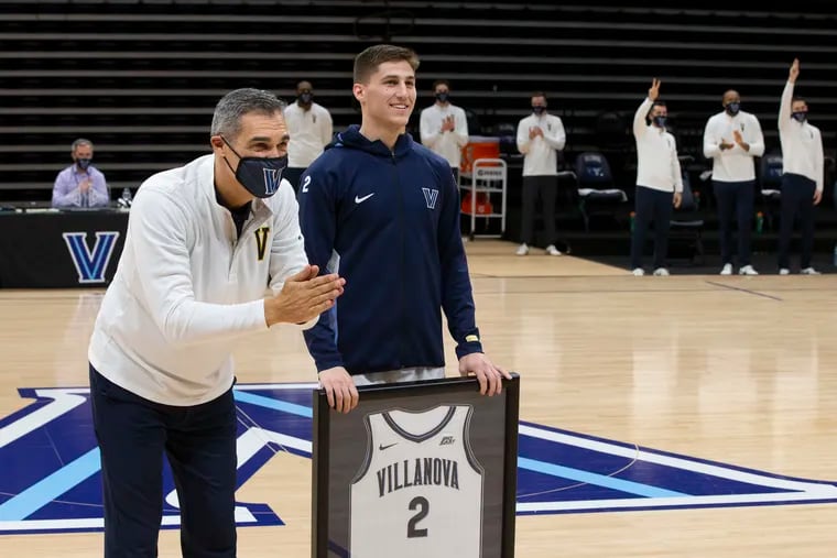 Coach Jay Wright (left) and player Collin Gillespie of Villanova, shown on Senior Day before the March 3 game against Creighton, were named the Big 5 men's basketball coach and player of the year, respectively, in a vote of coaches and media.