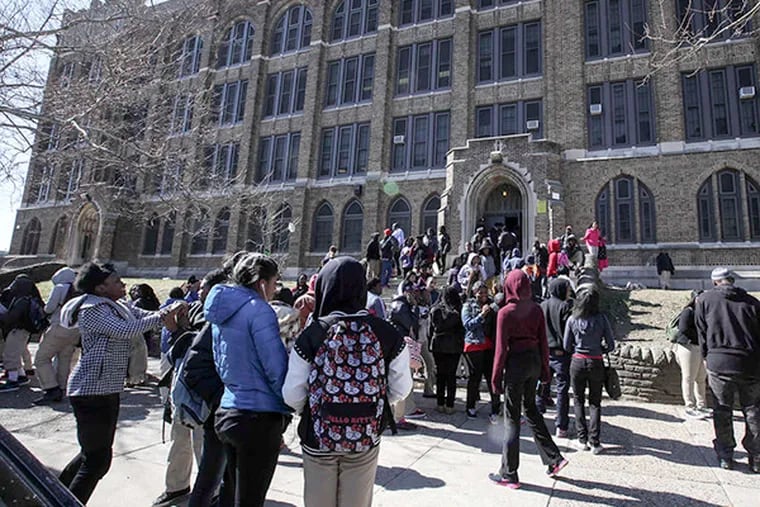 Students exit Bartram High School in Southwest Philadelphia following a recent fight that led to a school lockdown. Last week, nine students were suspended for a fight in the school's cafeteria. On March 21, a student fractured the skull of a conflict-resolution specialist.