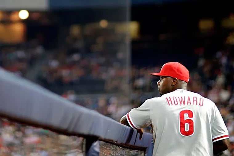 Philadelphia Phillies' Ryan Howard stands in the dugout in the fifth inning of a baseball game against the Atlanta Braves, Thursday, Sept. 26, 2013, in Atlanta. (AP Photo/David Goldman)