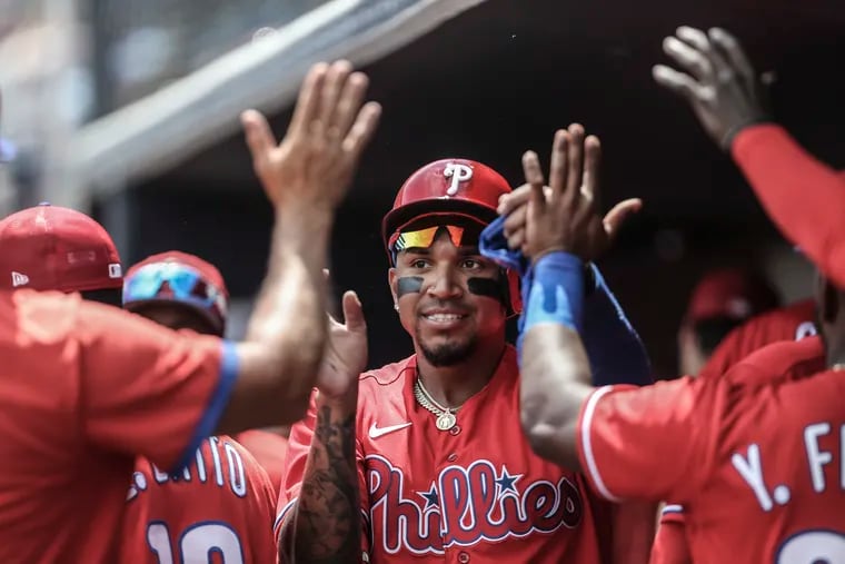 Phillies Johan Camargo celebrates scoring on a Garrett Stubbs sacrifice fly ball against the Yankees during the 4th  inning at George M. Steinbrenner Field in Tampa, FL, Monday, April 4, 2022. Yankees beat the Phillies 5-2.