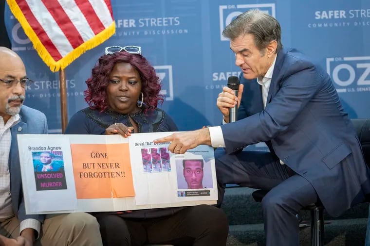 State Rep. Chris Rabb (D., Philadelphia), far-left, at a campaign event for Republican Senate candidate Mehmet Oz, right. At center is Sheila Armstrong, whose family members have been killed in gun violence.