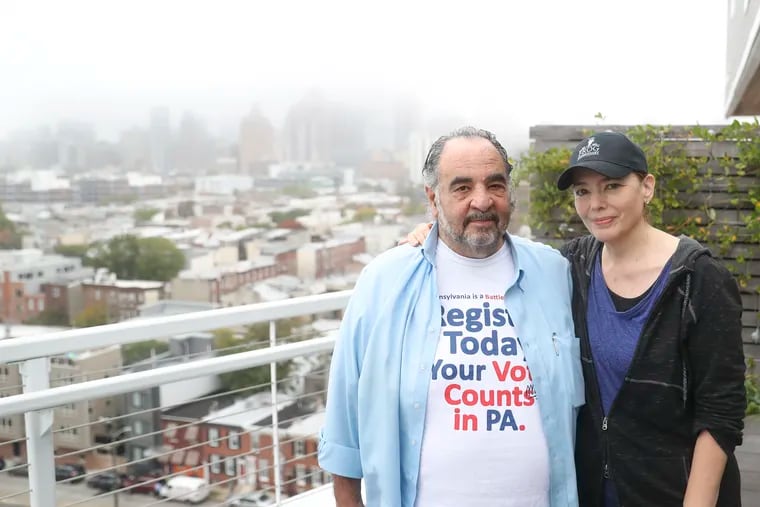 Steve Poses, restaurateur and caterer behind Frog Commissary, with his wife, Christina Sterner, who is president of the company, on the roof deck of their home in Philadelphia. Poses is retiring after half a century in the hospitality industry.