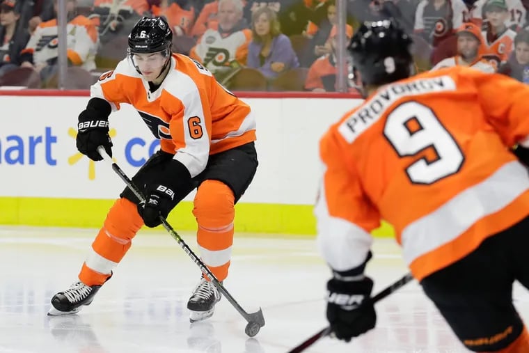 Travis Sanheim (left), in his first full NHL season, has become one of the Flyers' best defensemen,