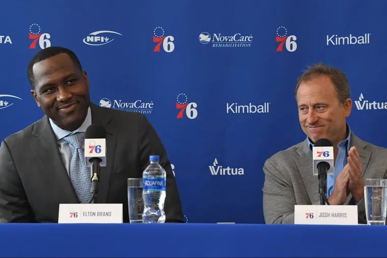 Joshua Harris (right), majority owner of the 76ers, introduces Elton Brand at Thursday's news conference.