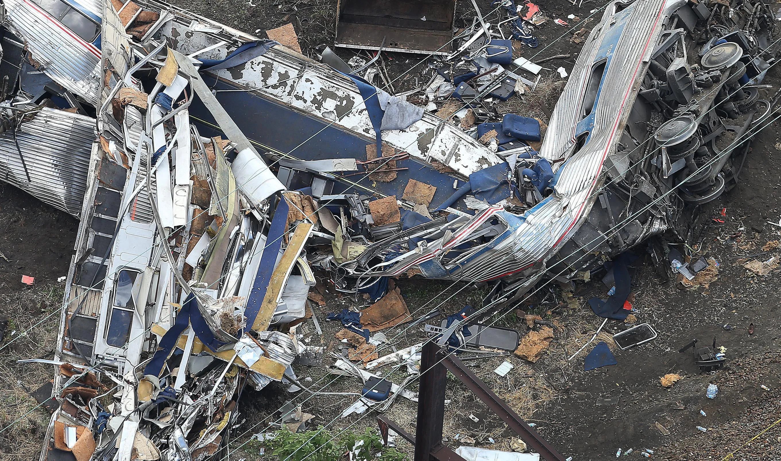 The remains of one of the rail cars from Amtrak train 188 derailment rest at the scene in the Port Richmond section of Philadelphia in May 2015.