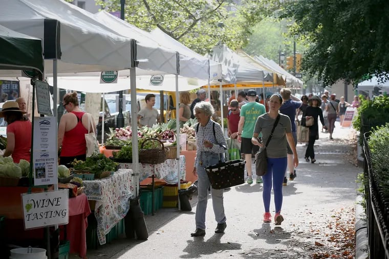 People shop at the Rittenhouse Farmers' Market in Philadelphia's Rittenhouse Square on Saturday, July 6, 2019.