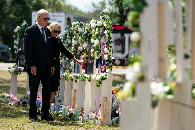 President Joe Biden and first lady Jill Biden visit a memorial at Robb Elementary School to pay their respects to the victims of the mass shooting.