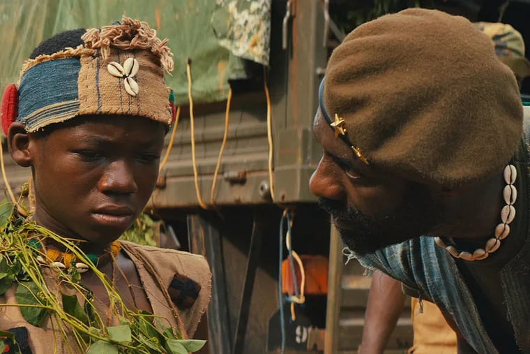 Idris Elba and Abraham Attah in the Netflix original film "Beasts of No Nation." (TNS/Netflix)