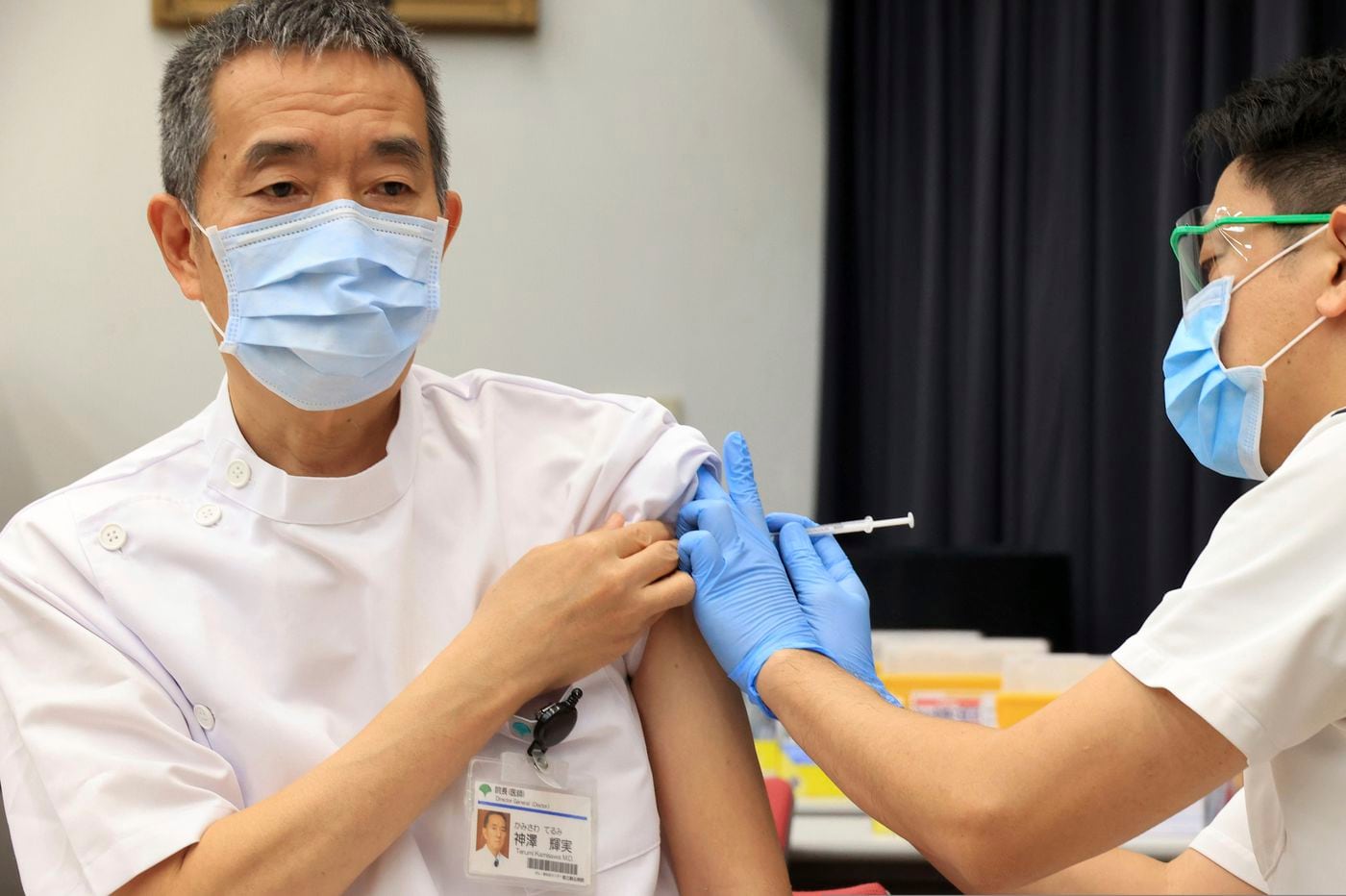 Japan extends virus emergency for 2 weeks for Tokyo area