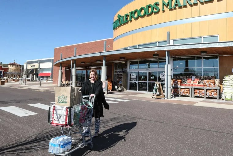 Liz Mills of Lower Gwynedd leaves the Whole Foods at Plymouth Meeting Mall.