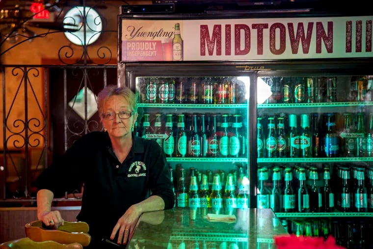 Bartender Ellen Erickson pauses between patrons, at the bar at the Midtown III, on South 18th Street October 22, 2018.
